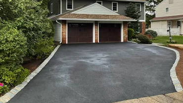 Driveway paving crew compacting asphalt in Passaic County NJ